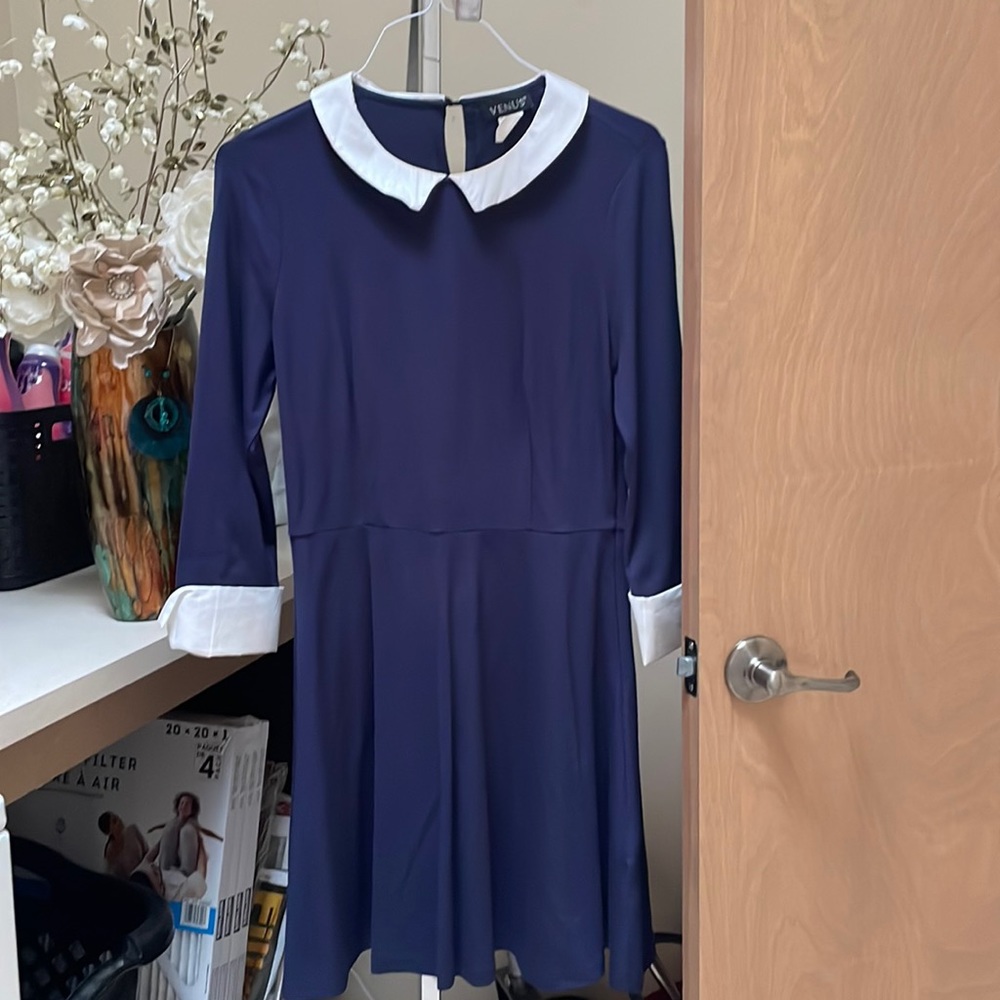 Navy blue dress with white collar and white cuffs